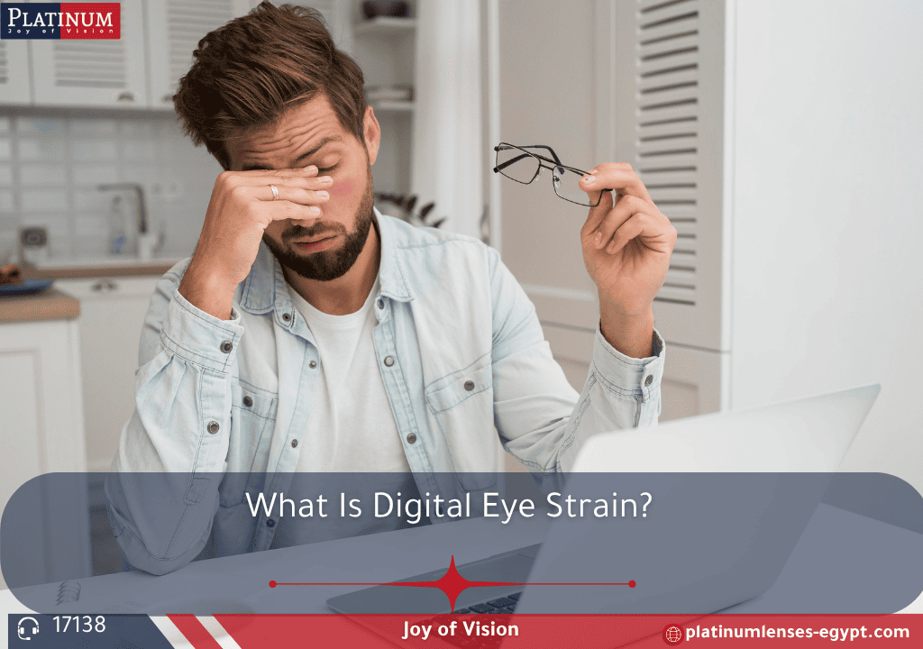Person rubbing eyes from digital eye strain in front of computer